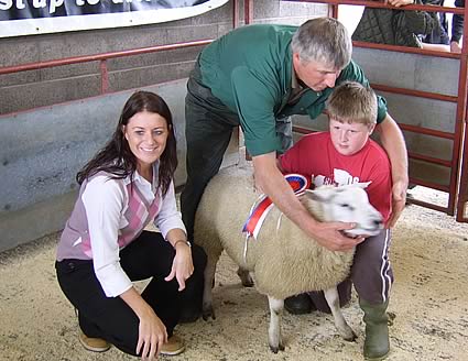 Mel from Farmers Guardian with Mr Hope and Thomas after judging of championship